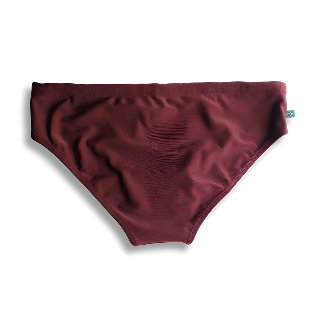 Barolo burgundy solids men’s swimming sunga in smooth stretchy fabric with small Brazilian flag tag on the side