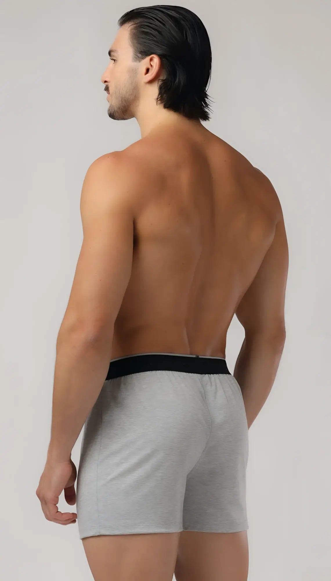 Basic boxer gray athletic shorts with black elastic waistband designed for comfortable activewear use