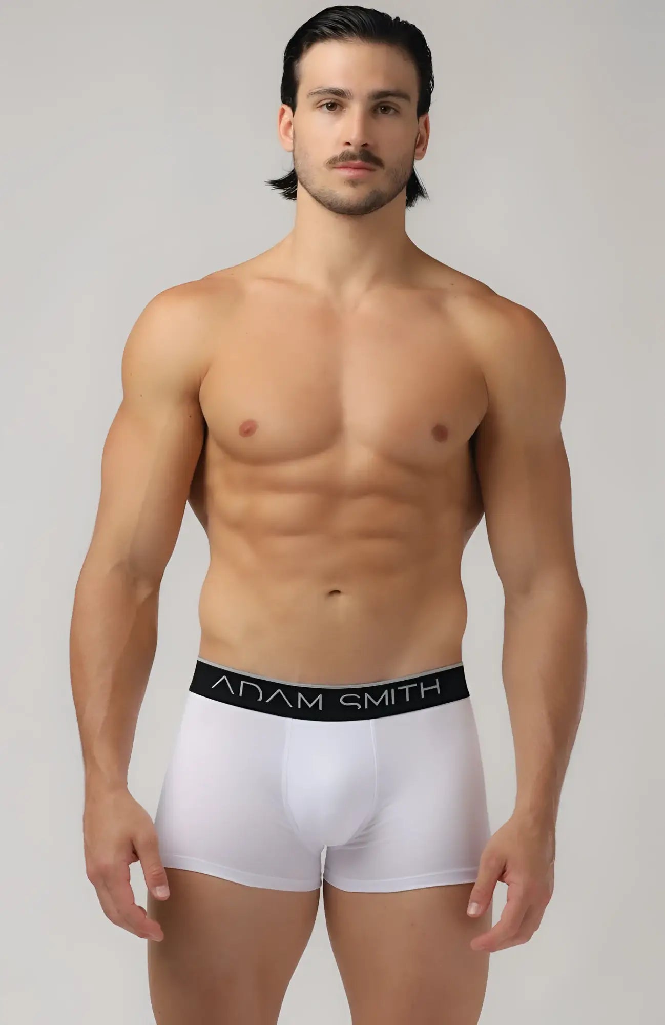 White adam smith basic boxer trunks with black elastic waistband featuring brand name in white lettering