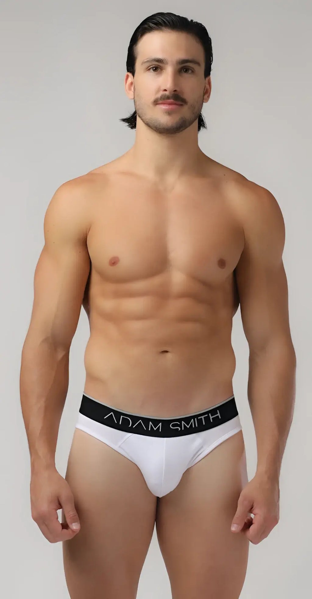 White adam smith basic briefs featuring a black waistband with white brand name lettering in a cotton fabric design