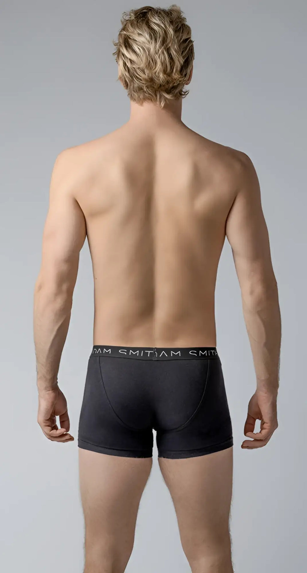 Black men’s briefs basic trunks with a snug fit elastic waistband and smitjam brand name in white lettering