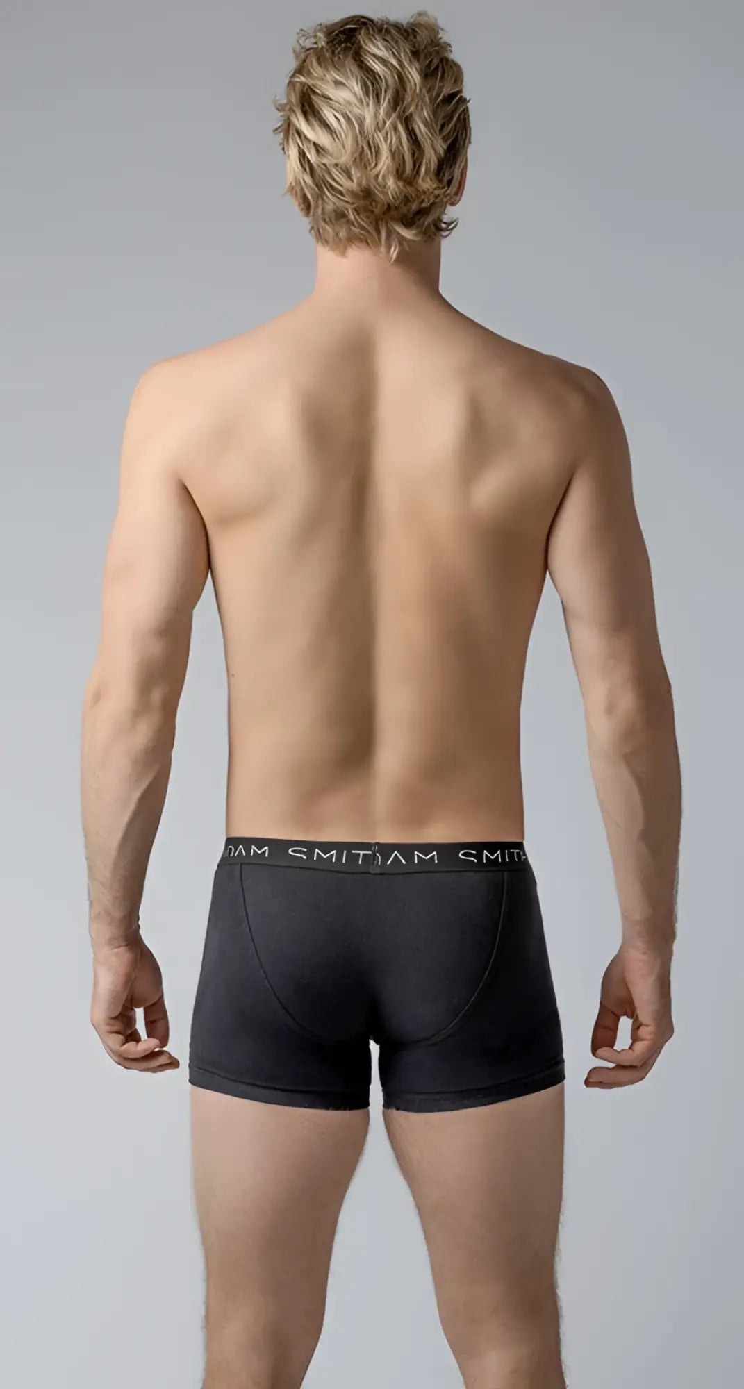 Black men’s briefs basic trunks with a snug fit elastic waistband and smitjam brand name in white lettering