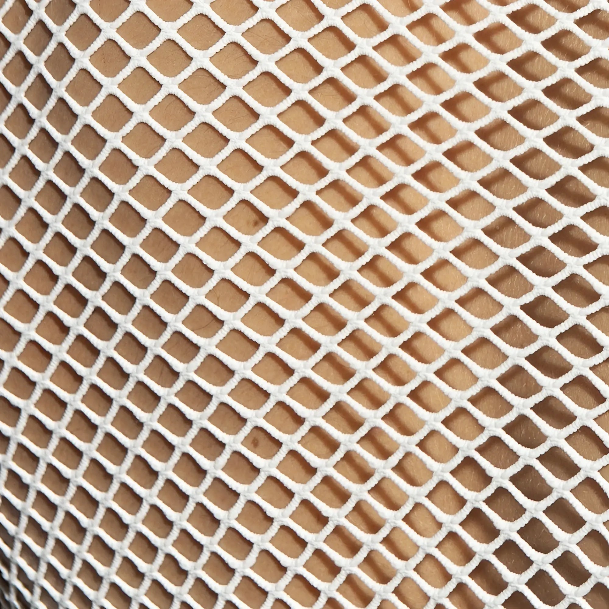White mesh fabric with a diamond-shaped pattern on the beachy net strap tank top