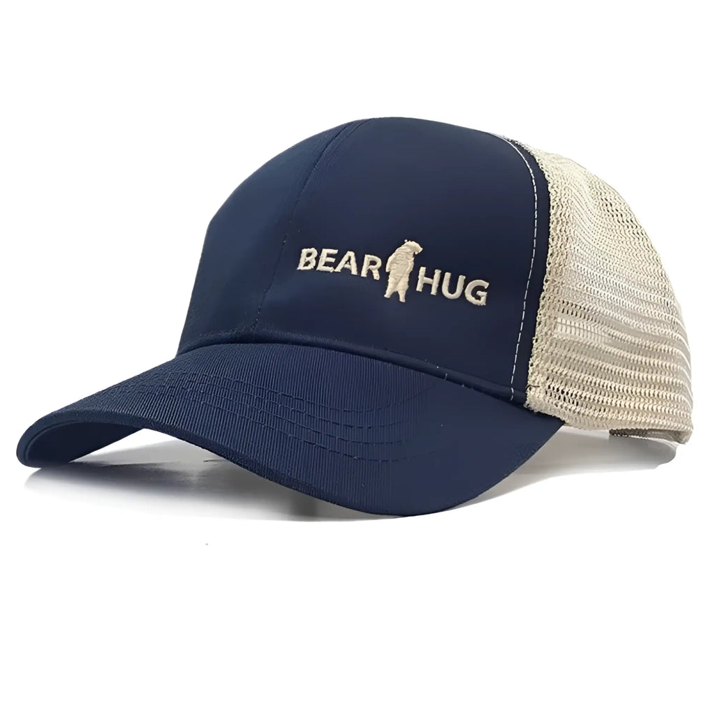 Navy blue and beige trucker cap with embroidered bear hug logo featuring breathable mesh panels