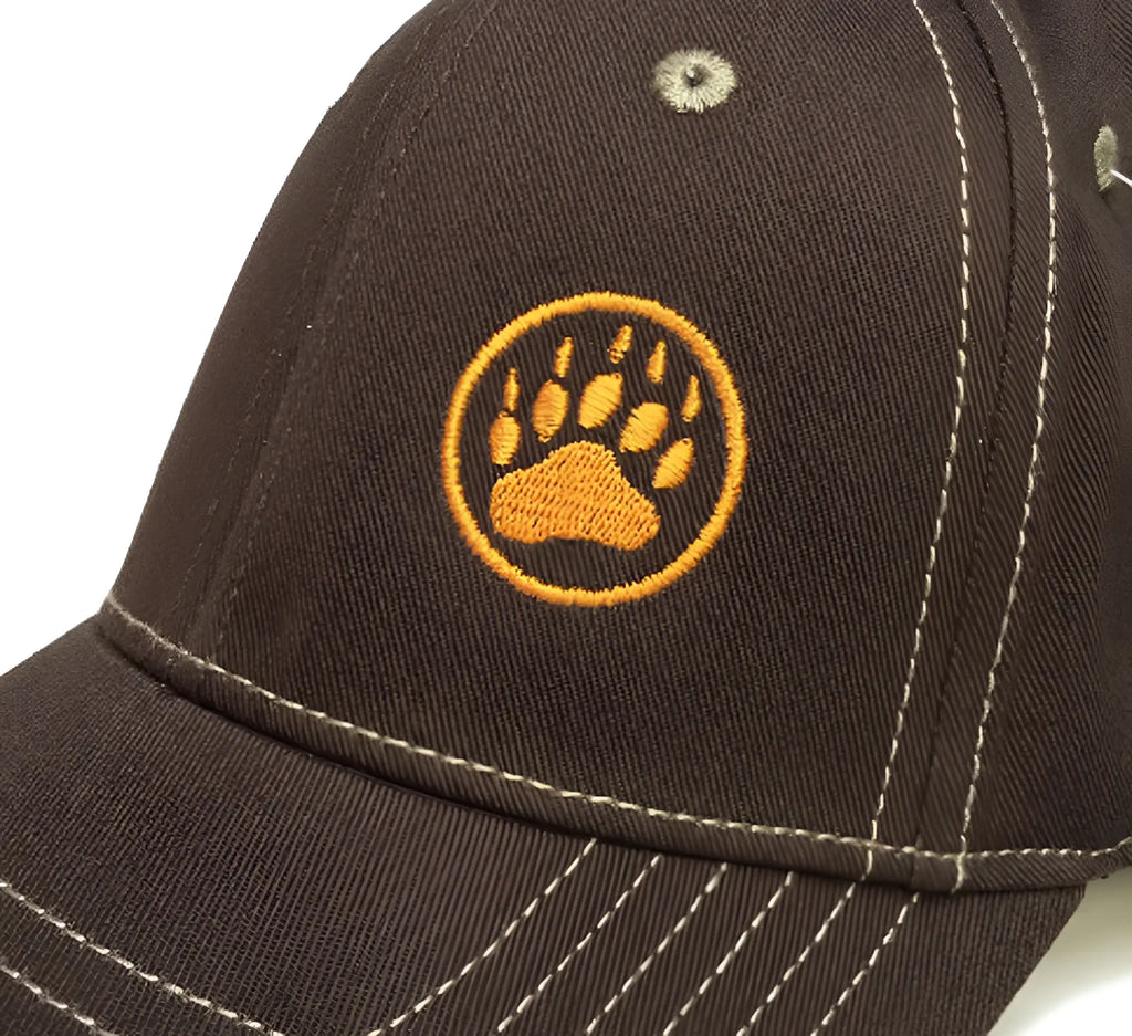 Brown baseball cap with circular embroidered golden-yellow bear paw logo in golden-yellow thread
