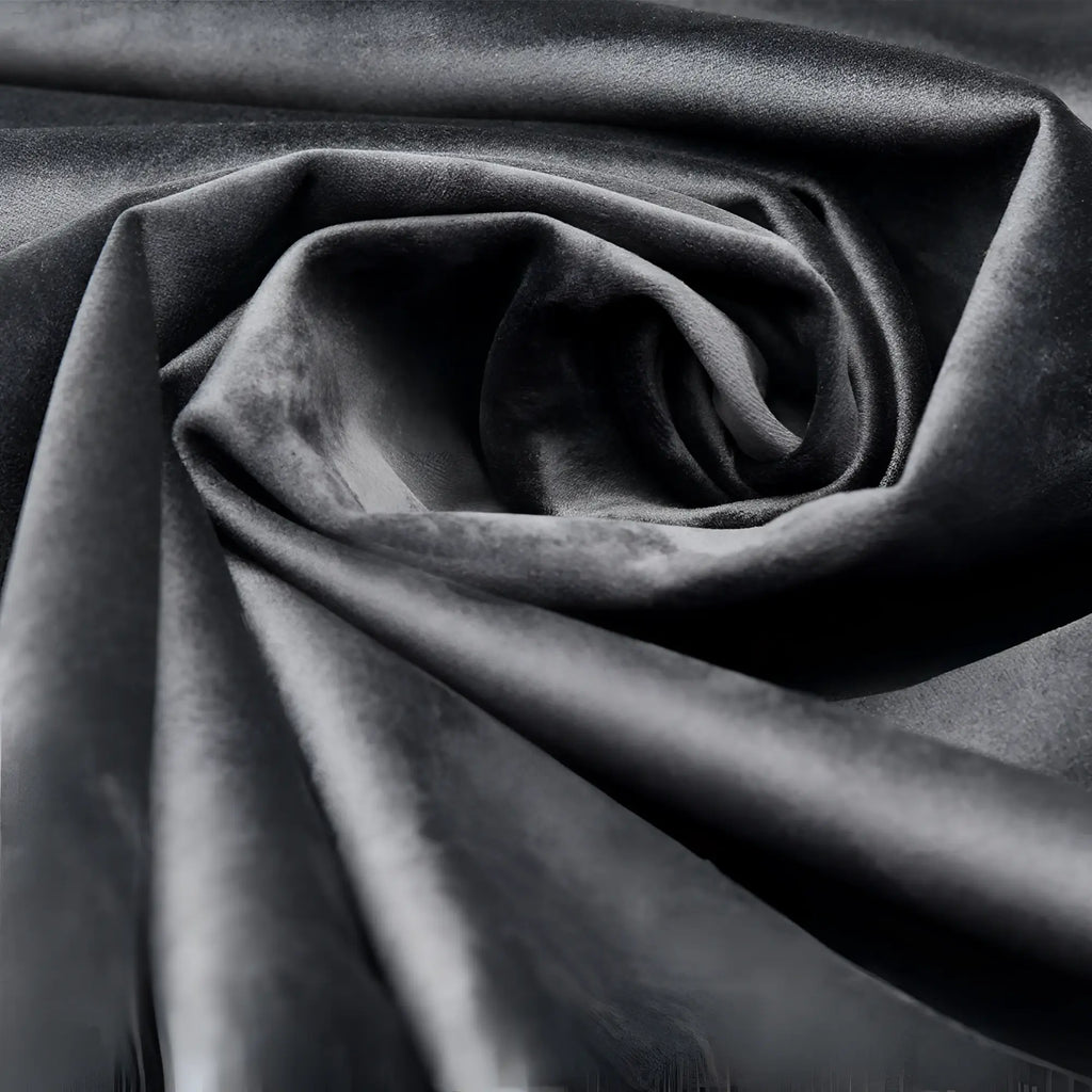 Close-up of the Bedroom Bliss Waterproof Throw in solid black, featuring a soft, folded velvet-like texture.