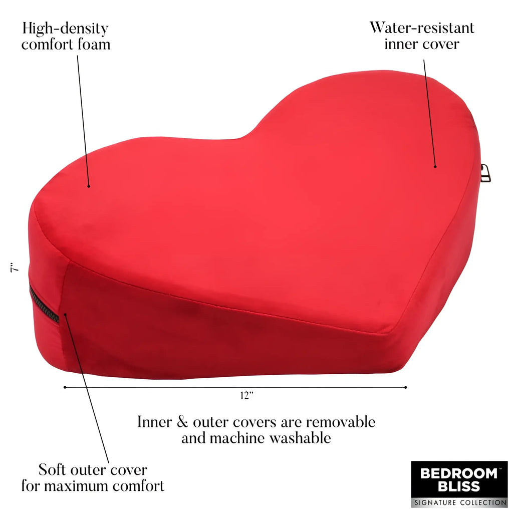 Bedroom Bliss The Heart Pillow: A red heart-shaped foam cushion with labeled features, 12" wide and 7" tall.