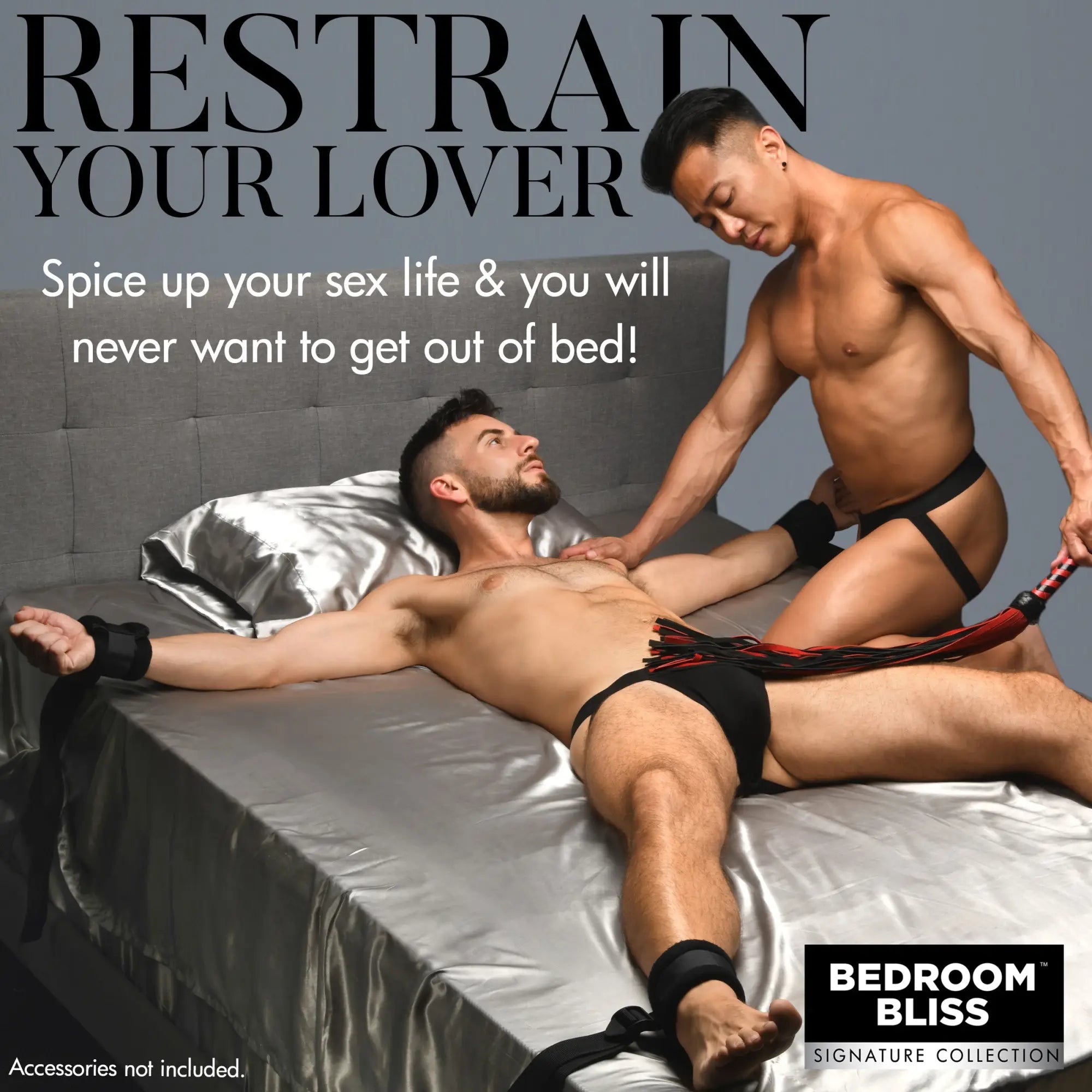 Bedroom Bliss Lover's Bed Restraint System featuring black adjustable wrist and ankle straps on a satin-sheeted bed.