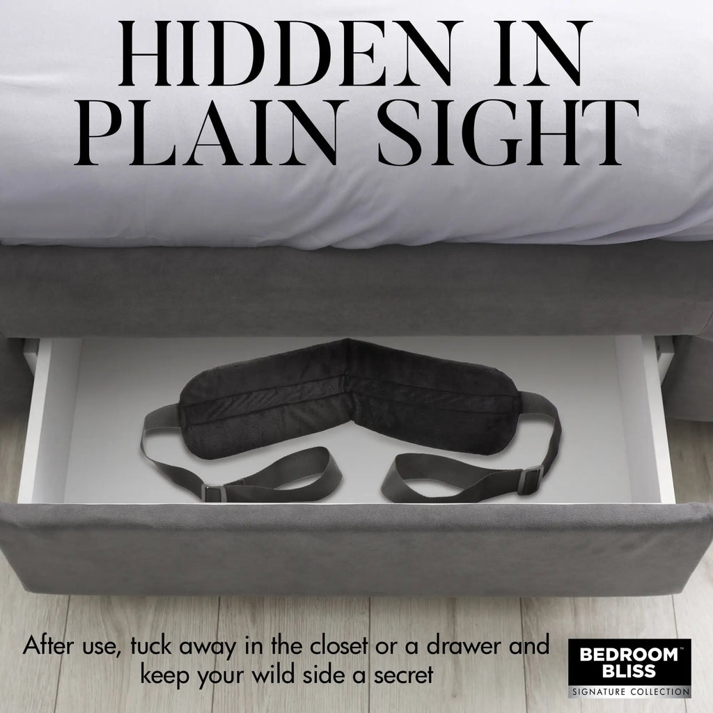 Bedroom Bliss Lover's Doggy Style Strap: A black plush padded strap with adjustable webbing in an open bedroom drawer.