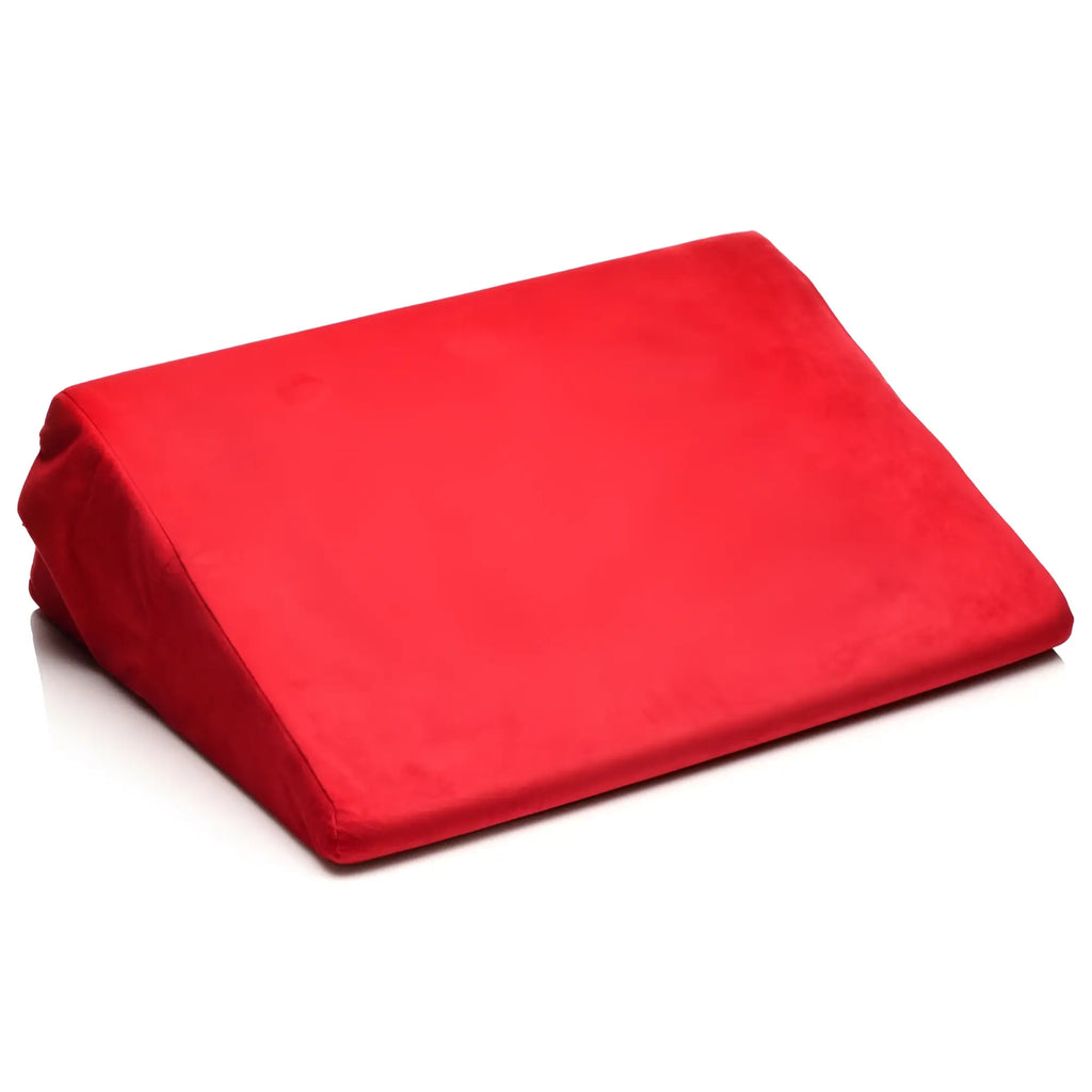 Bedroom Bliss Small Love Cushion: A red, wedge-shaped velvet pillow isolated on a white background.