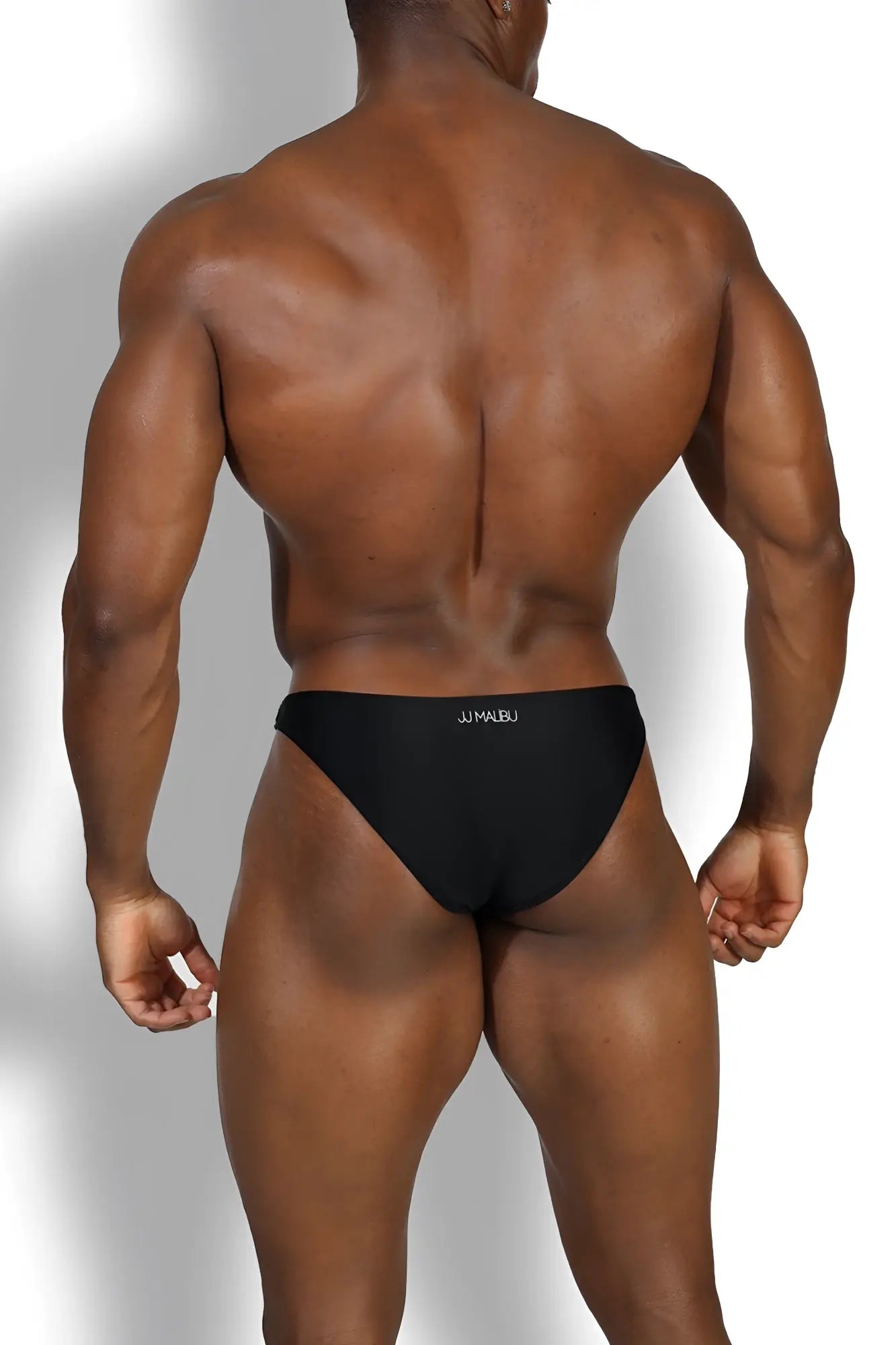 Black onyx bejeweled bikini swim briefs with subtle white logo on waistband in black briefs style