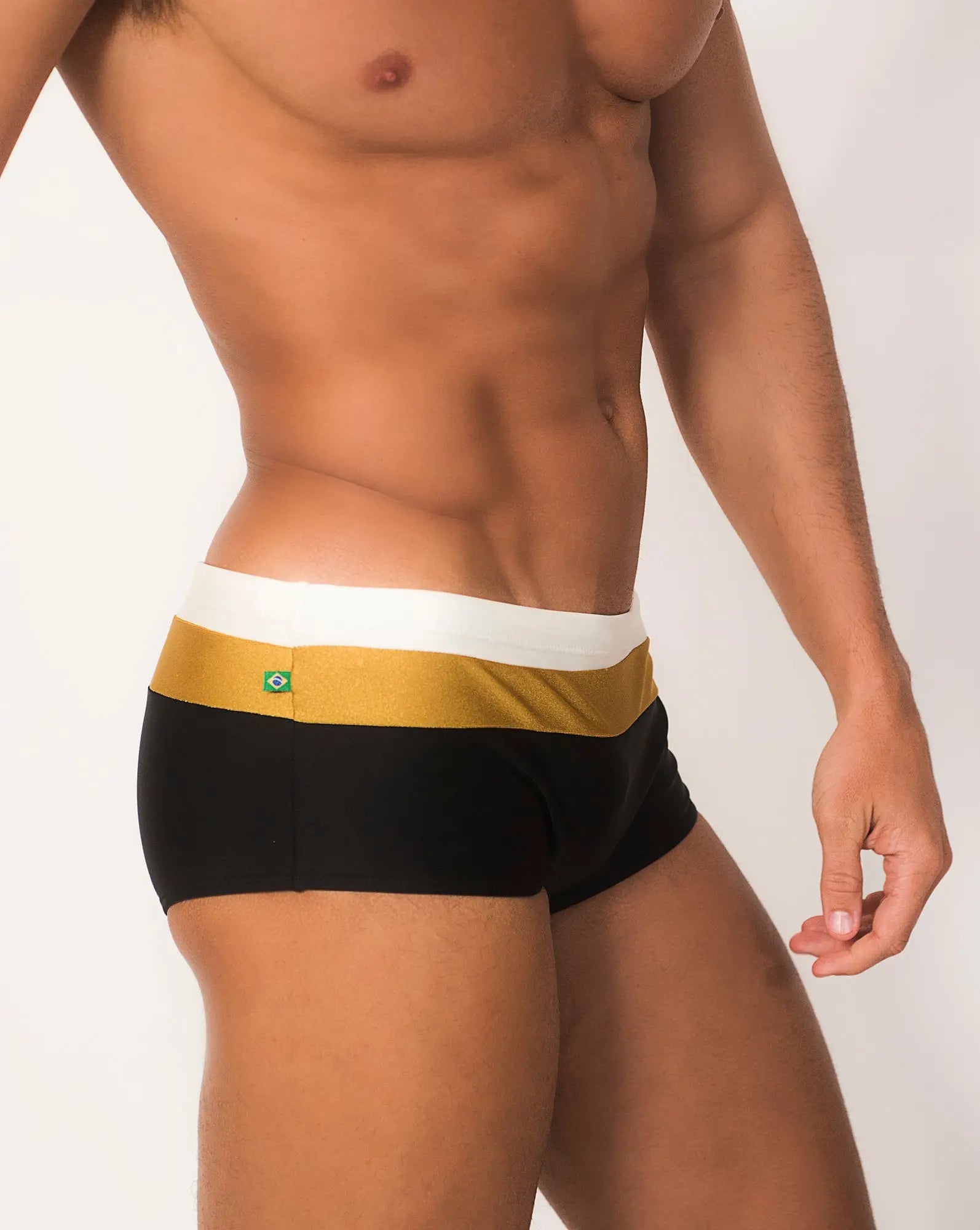 Black briefs Belmont Trio Sunga swim shorts with gold white striped waistband and small Brazilian flag emblem