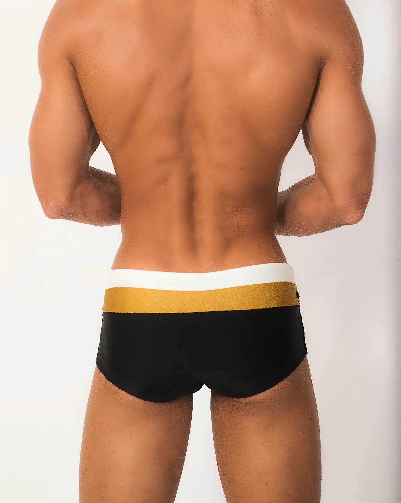 Black swim trunks belmont trio sunga with white and gold striped waistband designed for stylish beachwear