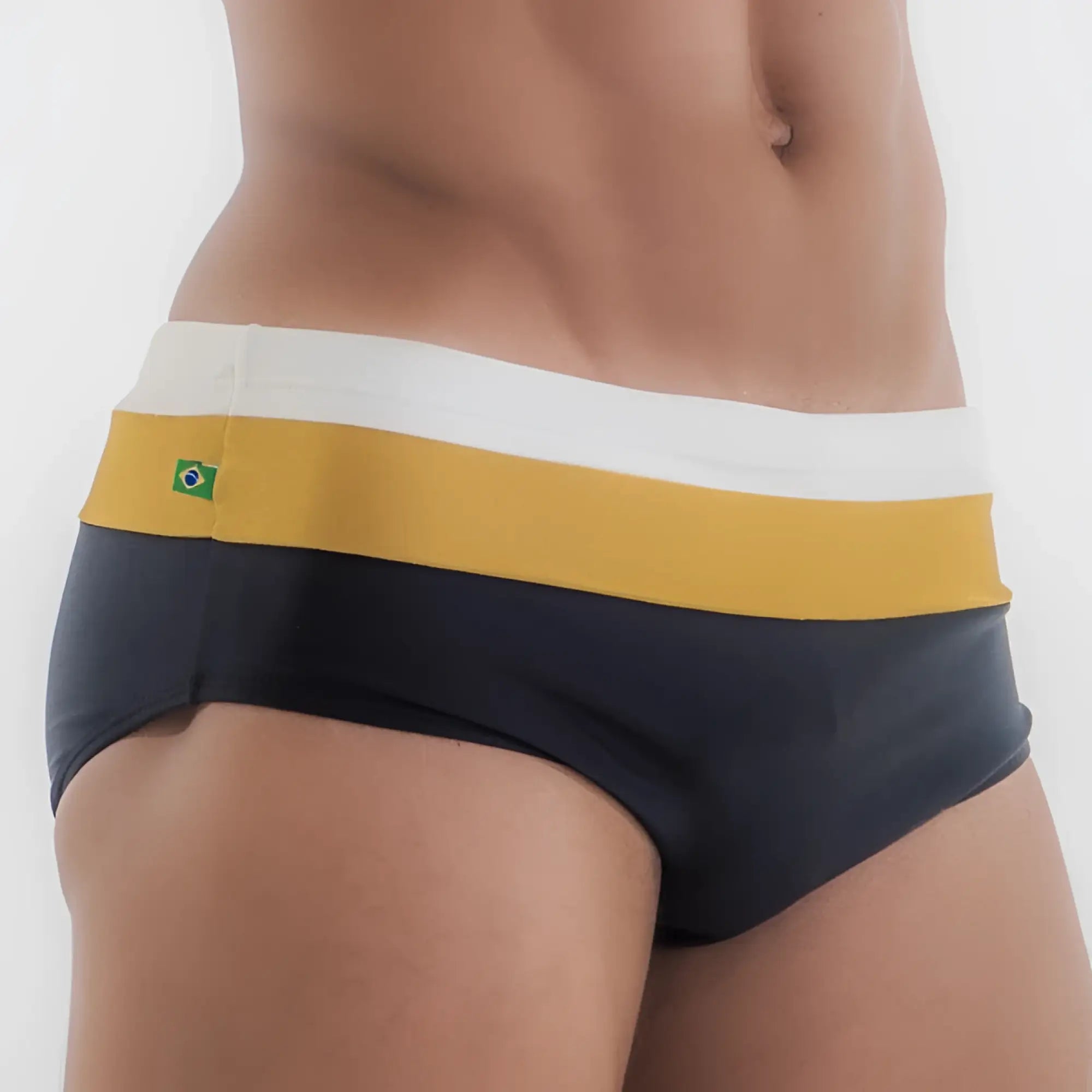 Dark navy belmont trio sunga designer swim shorts with bold yellow white striped waistband and small brazilian flag emblem