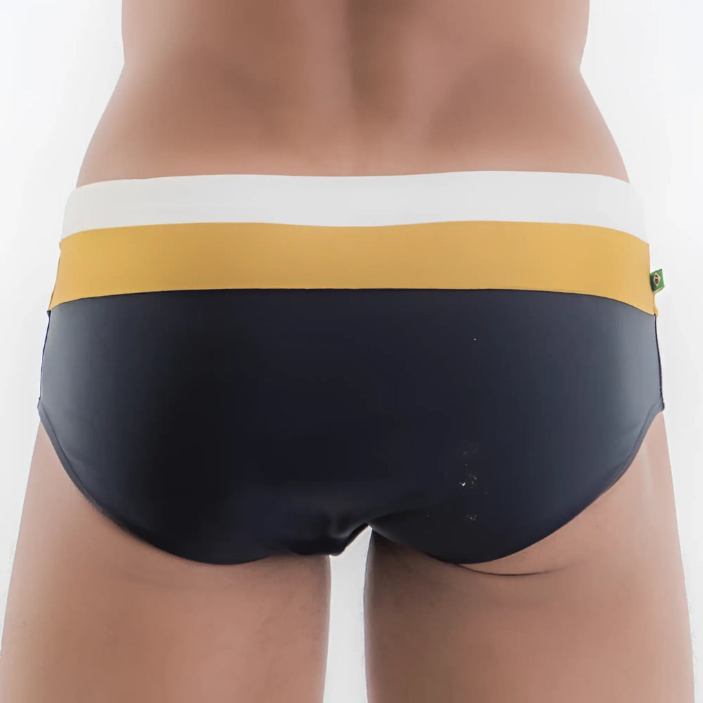 Navy blue Belmont Trio Sunga designer swim shorts with a white and mustard yellow striped waistband for swimming