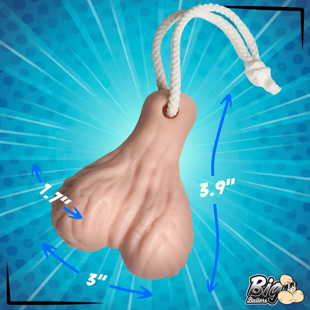 Big Ballers Balls Soap: A flesh-toned, testicle-shaped bar of soap with a white hanging rope and size measurements.