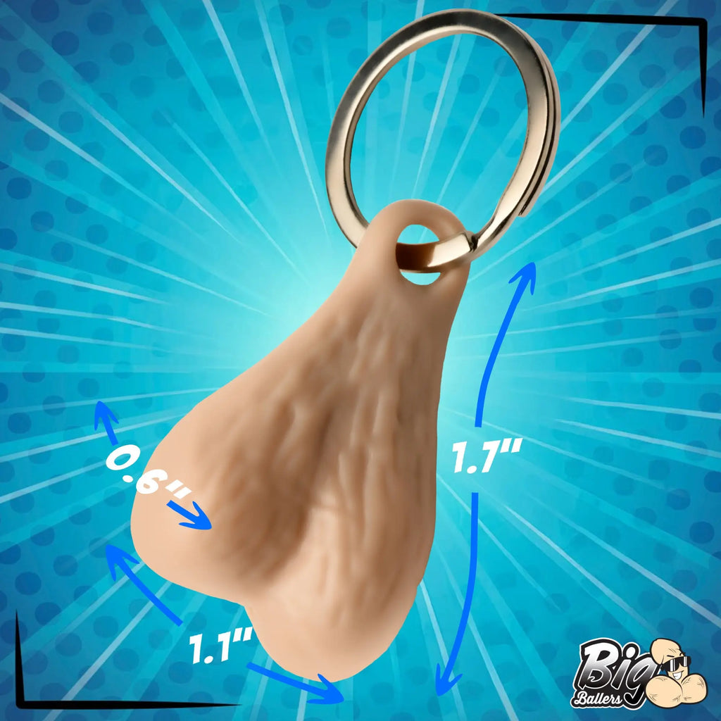 Big Ballers keychain: A flesh-colored, testicle-shaped pendant on a metal ring with blue dimension measurement lines.