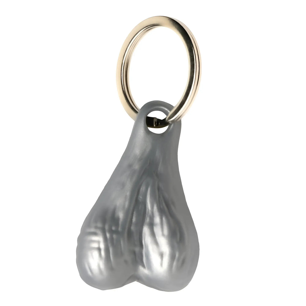 Big Ballers keychain featuring a silver, anatomically shaped testicle charm on a gold-tone metal keyring.