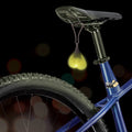 Big Ballers Teeny Weeny Truck Nuts: A glowing, heart-shaped silicone light hanging from a bicycle seat.