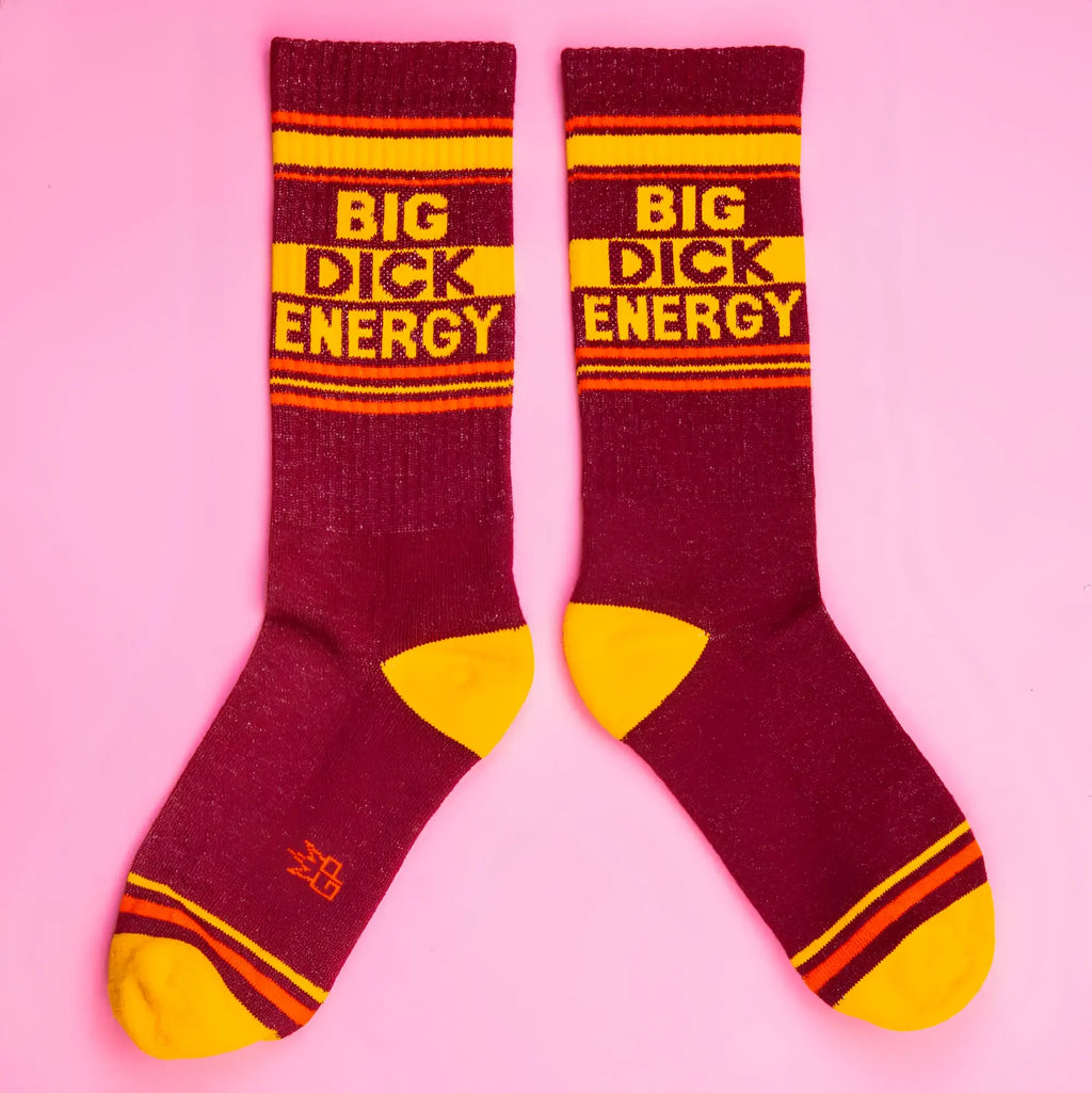 Maroon and yellow striped big dick energy crew socks made of textured knit material for bold casual wear