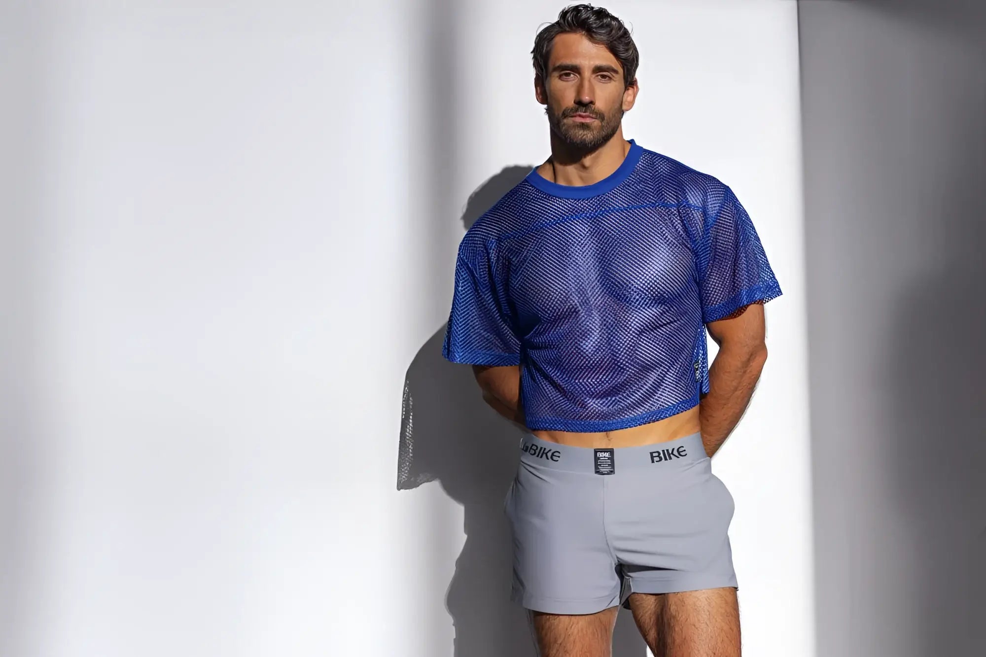 Blue mesh crop top short sleeve athletic practice jersey by BIKE in royal color made for active wear