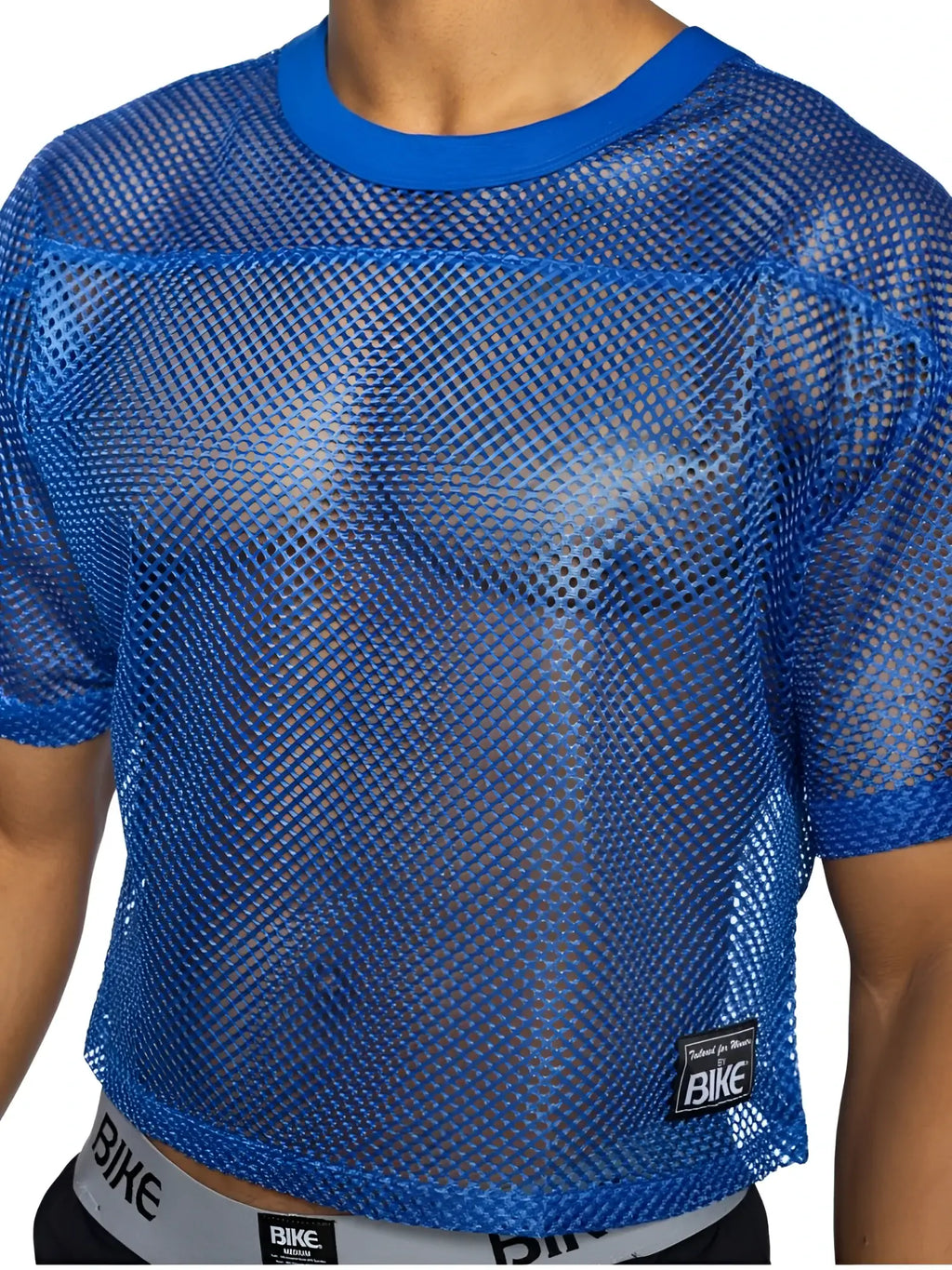Blue mesh crop top with solid blue ribbed neckline and sleeve cuffs featuring black bike brand patch lower right