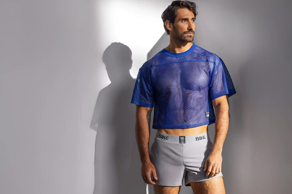 Blue mesh crop top short sleeve athletic practice jersey with round neckline in royal color by BIKE Athletic