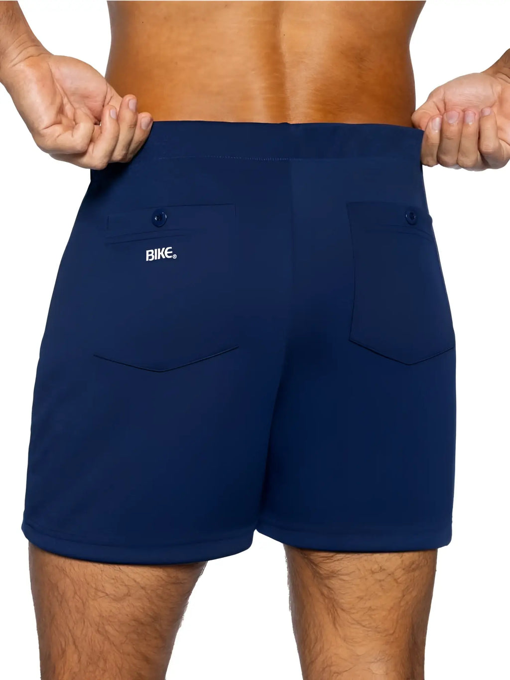 Back view of navy bike athletic bam207 coaches shorts with two back pockets and a white bike logo on left pocket