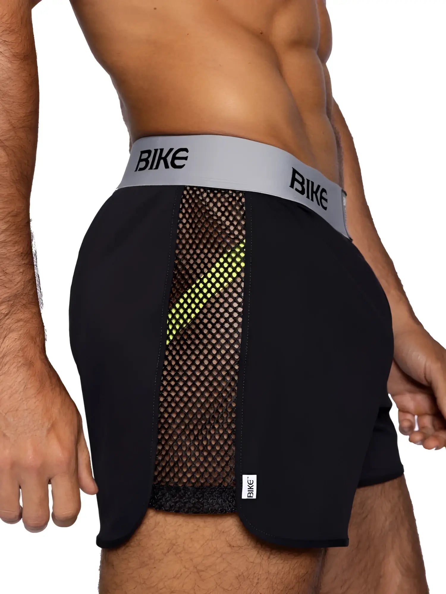 Black bike athletic BAM225 jock shorts with neon green mesh panel and gray branded waistband for activewear