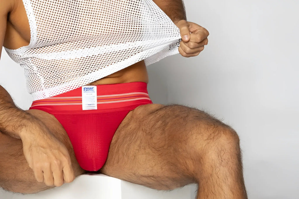Red bike athletic briefs with white stripes and original number 10 jockstrap label in vibrant red color