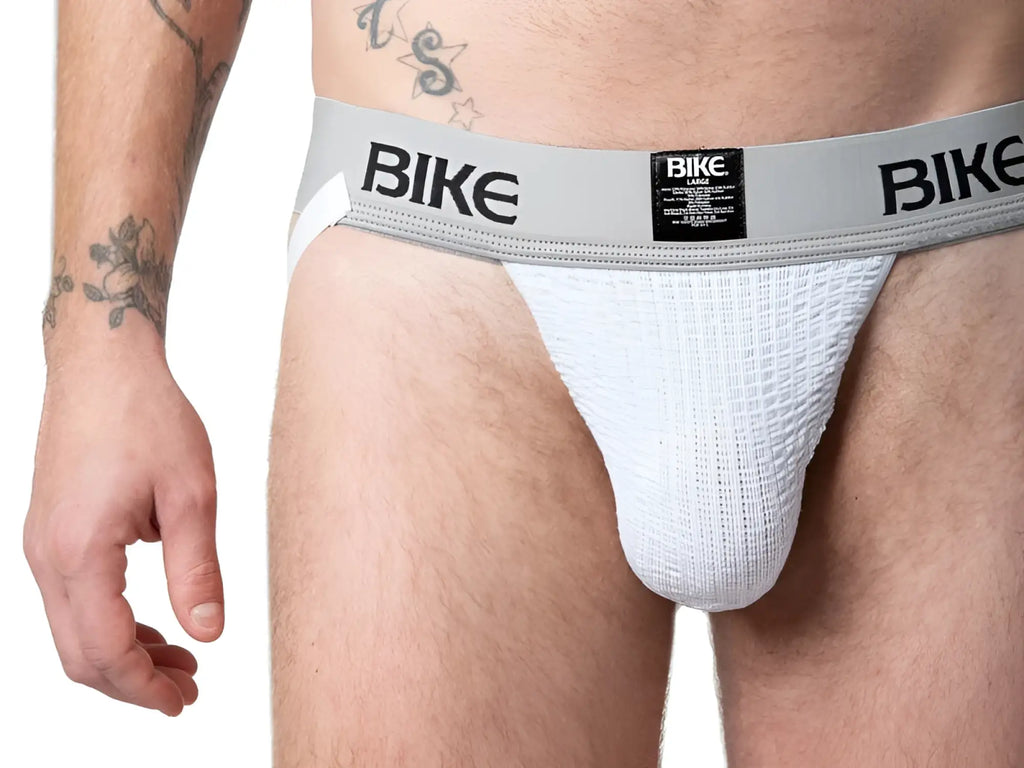 White textured bike classic jockstrap with gray waistband featuring black branding and size label visible