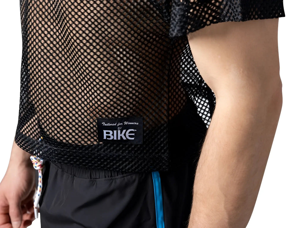 Black mesh short-sleeved bike practice jersey with tailored for winners by bike label on the back side