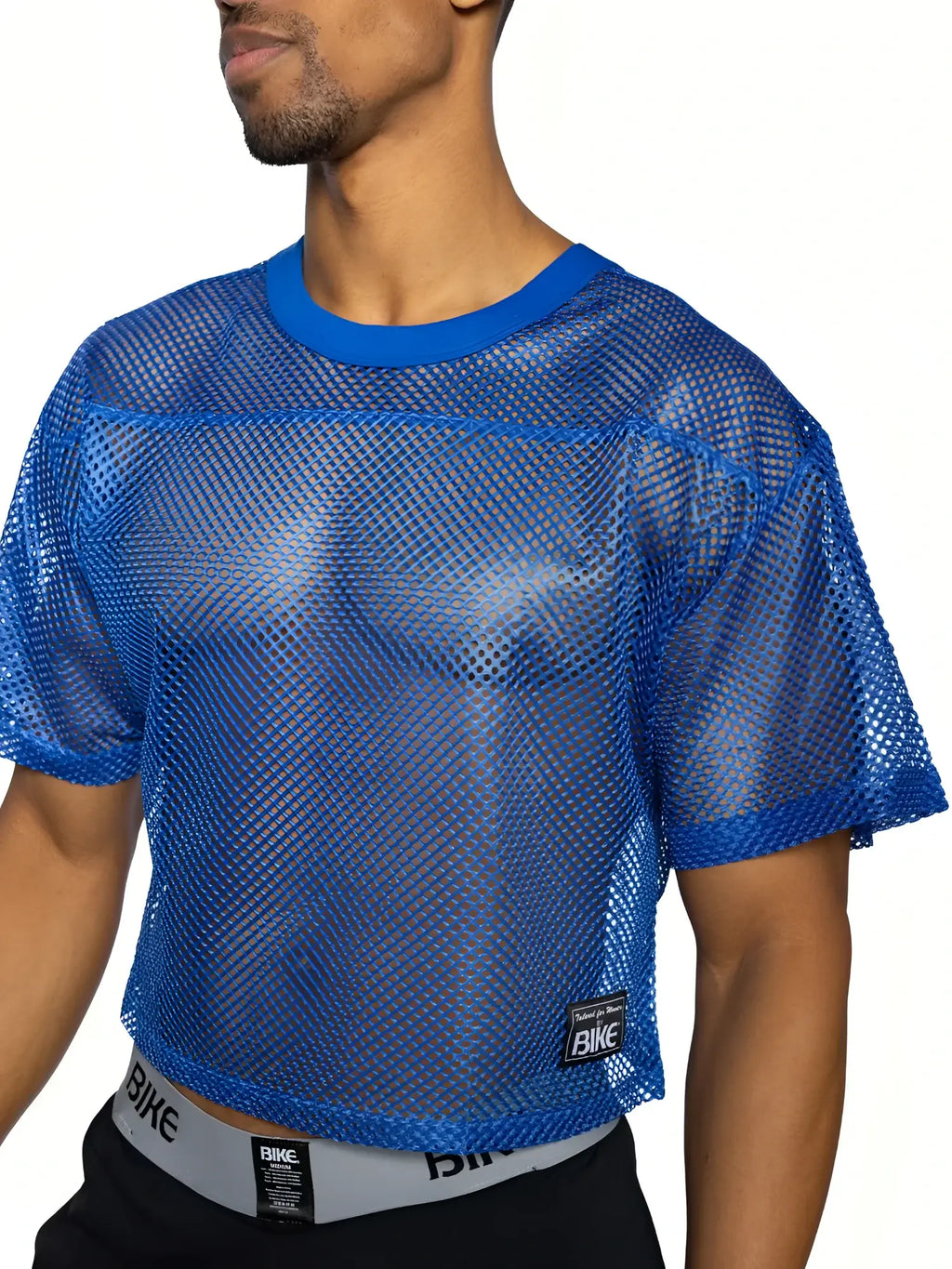 Blue mesh crop top bike practice jersey with solid blue ribbed neckline and sleeve cuffs