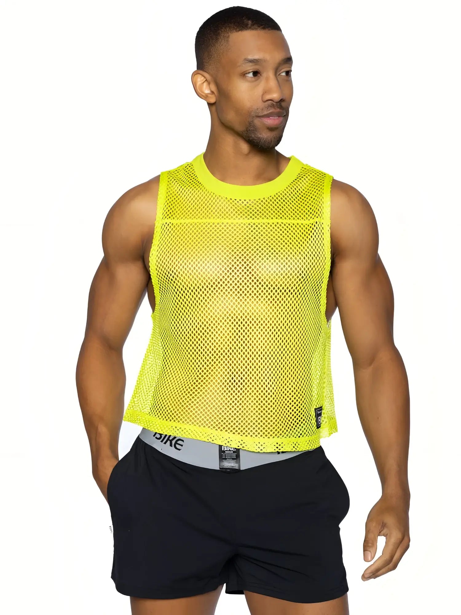 Bright neon yellow mesh sleeveless bike practice jersey with round neckline and subtle perforations