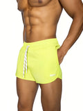 Bike track short in bright neon yellow with white striped drawstring and subtle brand logo on lower right leg