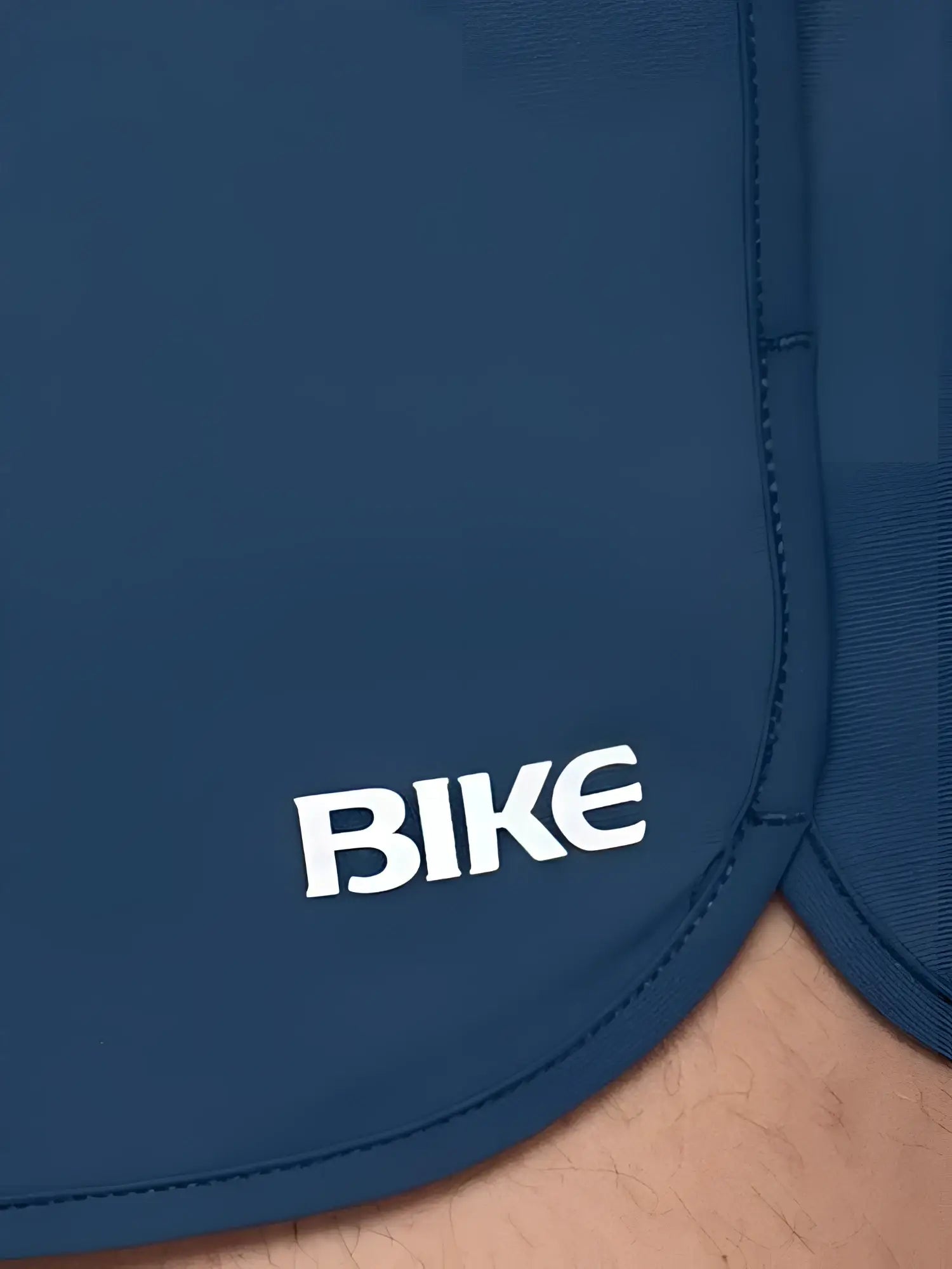 Dark blue Bike Track Short featuring white embroidered bike logo on the side made for athletic use