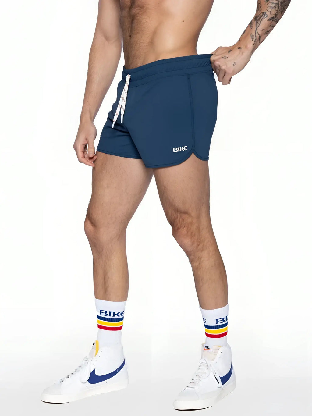 Navy blue bike track shorts with white drawstring and logo on the side designed for athletic use