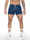 Navy blue bike track short with white drawstrings and small logo on lower right leg made for athletic use