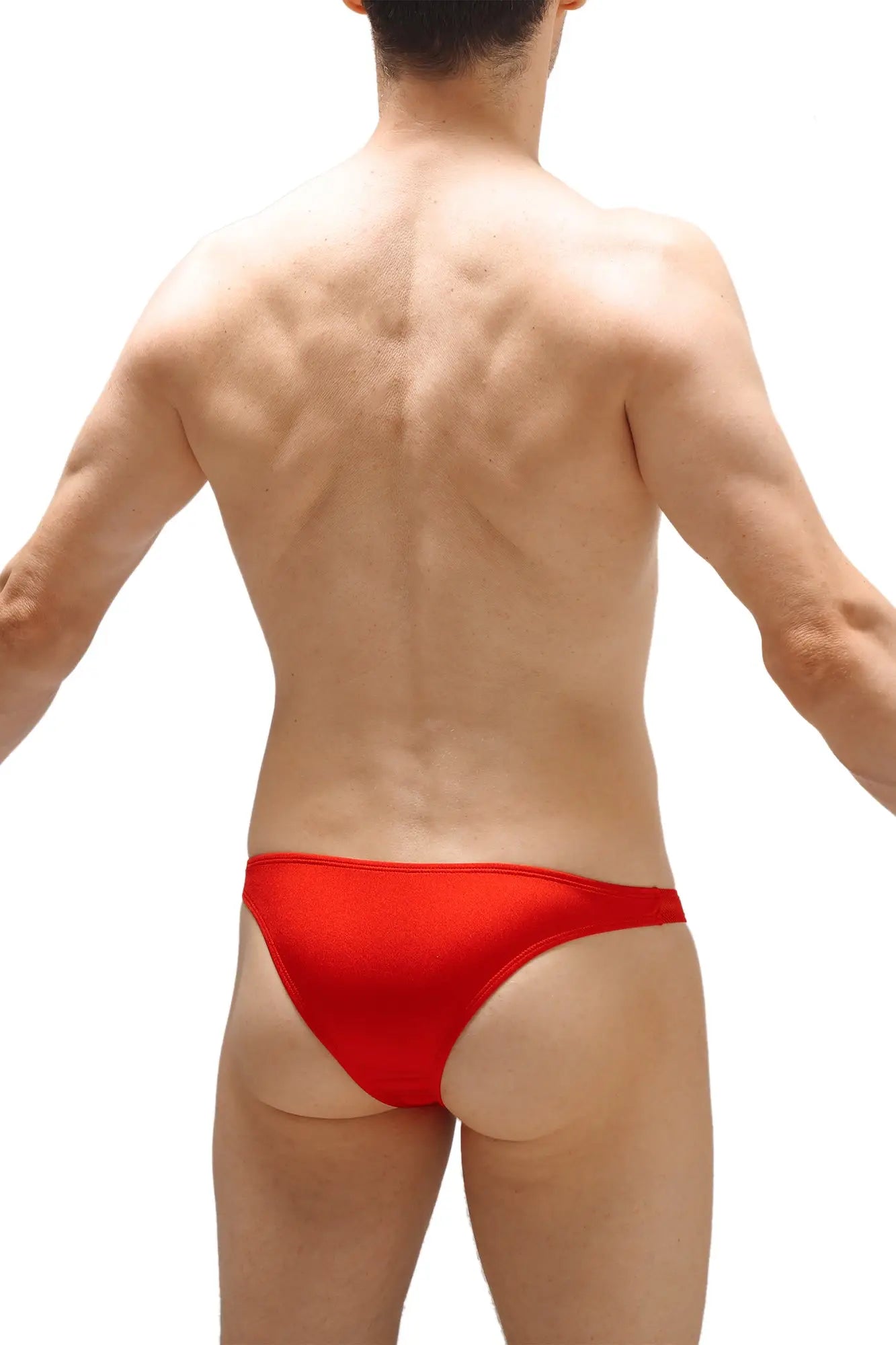 Red sleek form-fitting swim trunks made from smooth fabric ideal for beach and swimwear use