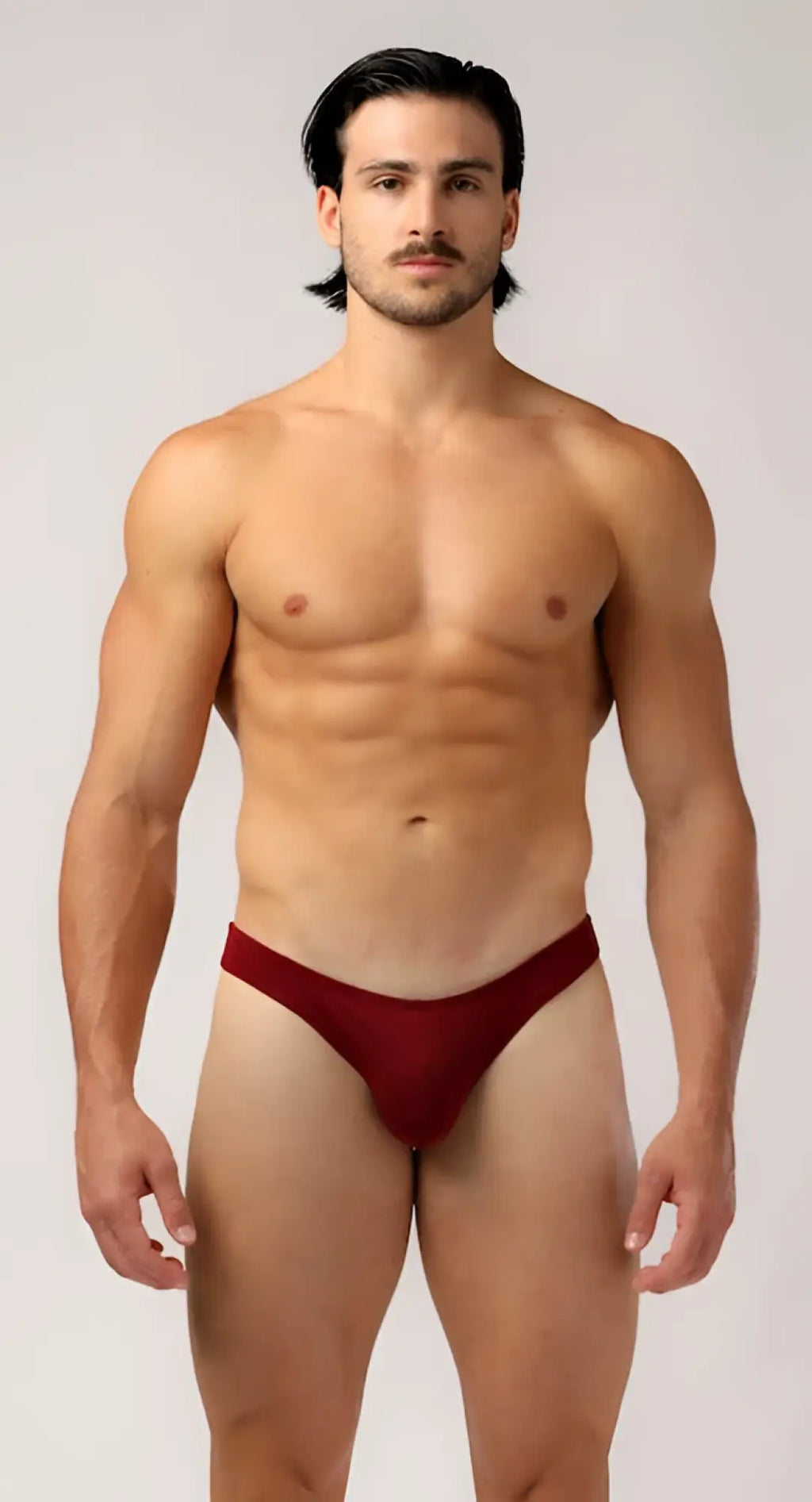 A sleek deep red as bikini brief thong made of smooth fabric