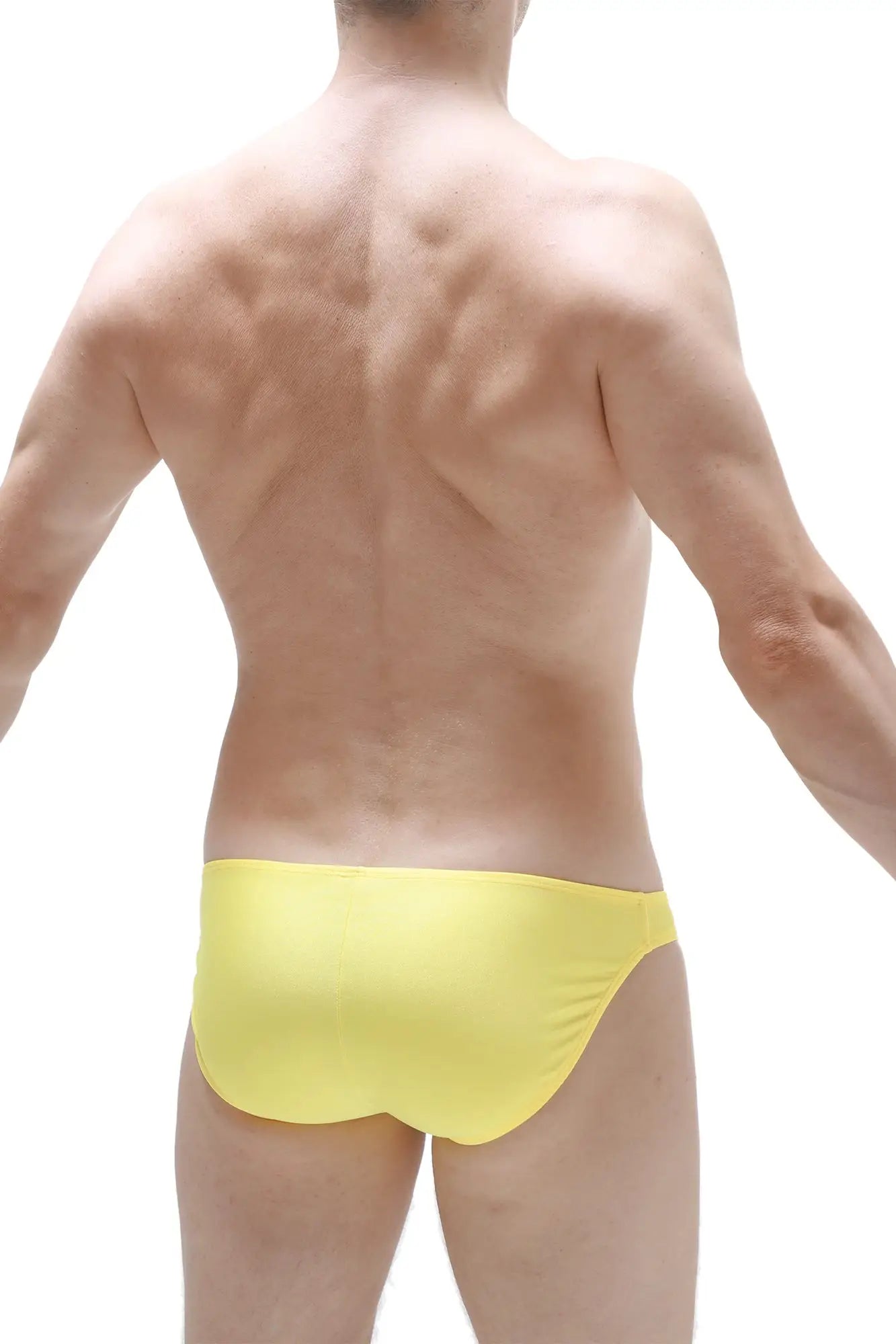 Bright yellow bikini taik joe swim trunks made of smooth form-fitting fabric perfect for beachwear
