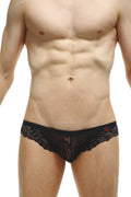 Black lace men’s bikini tregunc underwear with intricate floral patterns and a red logo on the waistband
