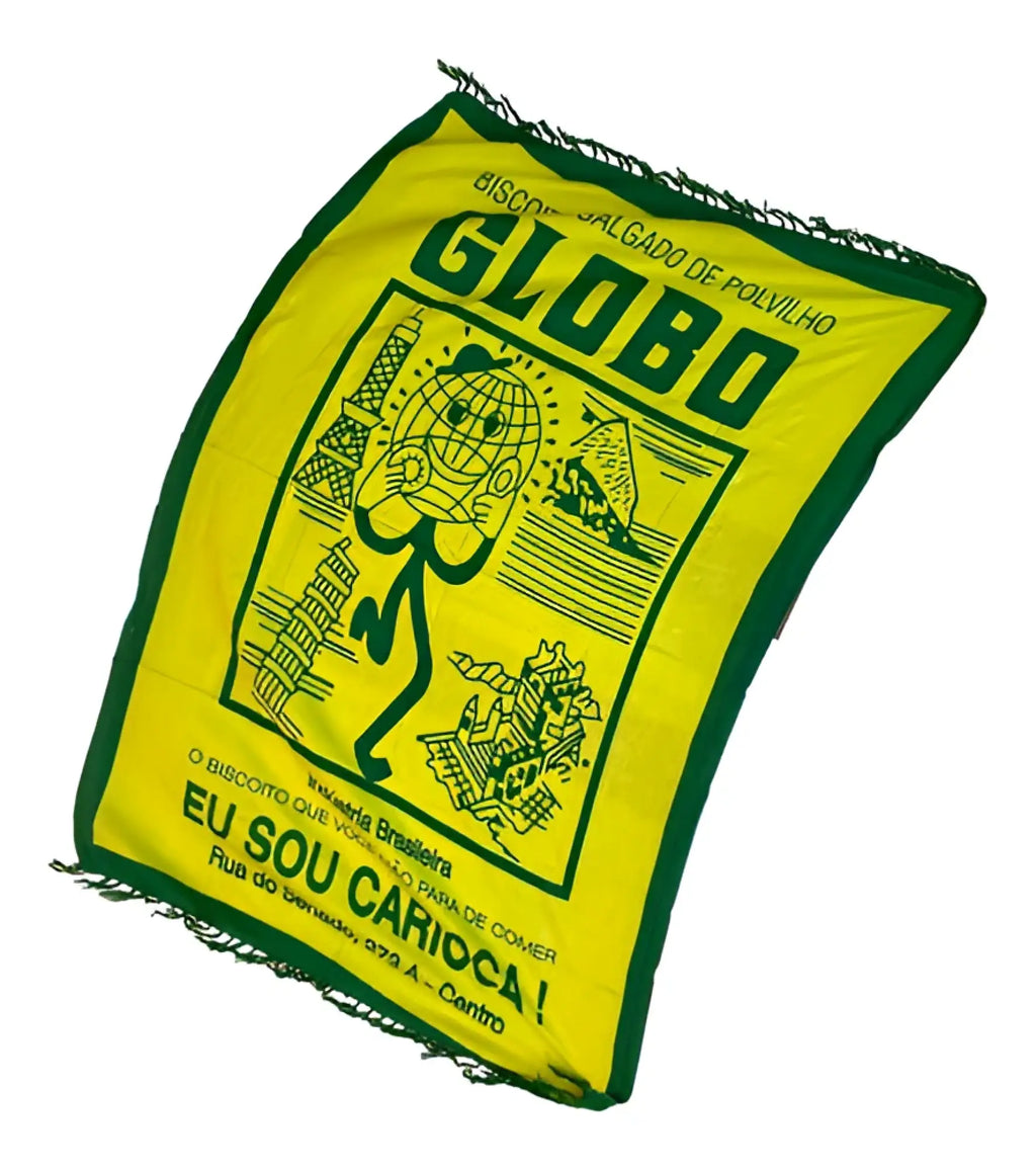 Bright yellow and green fringed beach canga featuring a cartoon globe and the word globo in bold letters