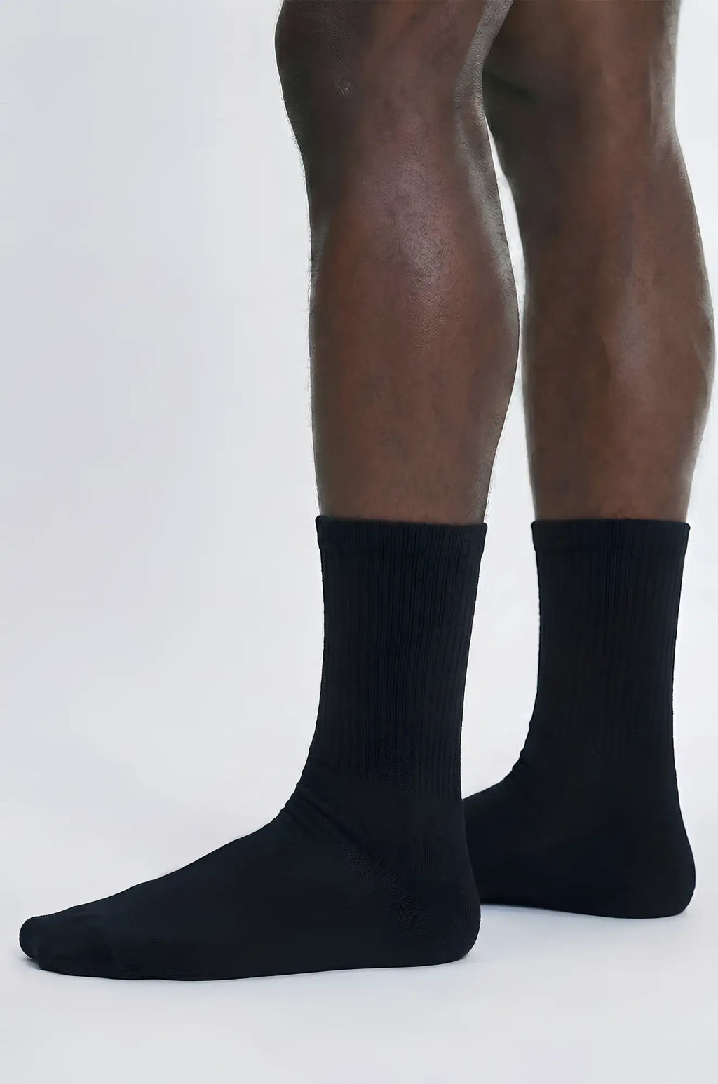 Black caviar crew sock in black with ribbed cuff and smooth solid fabric for comfortable everyday wear