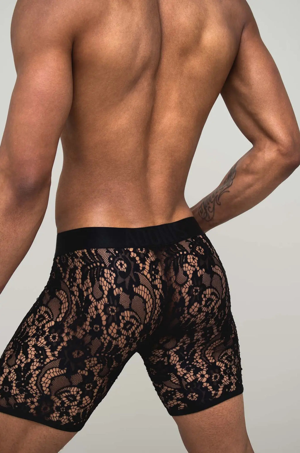 Black sheer lace boxer brief in black lace with a solid black elastic waistband for comfortable fit