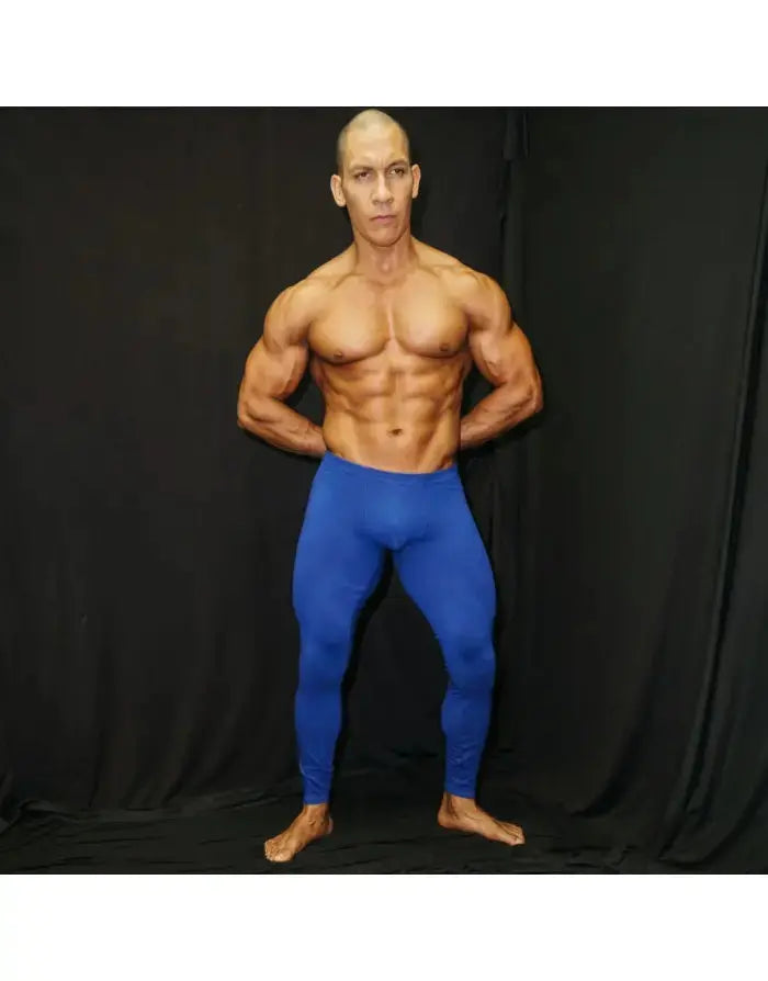Men's blue spandex tights by Arroyman featuring a fitted design smooth texture and full-length coverage worn by a model.