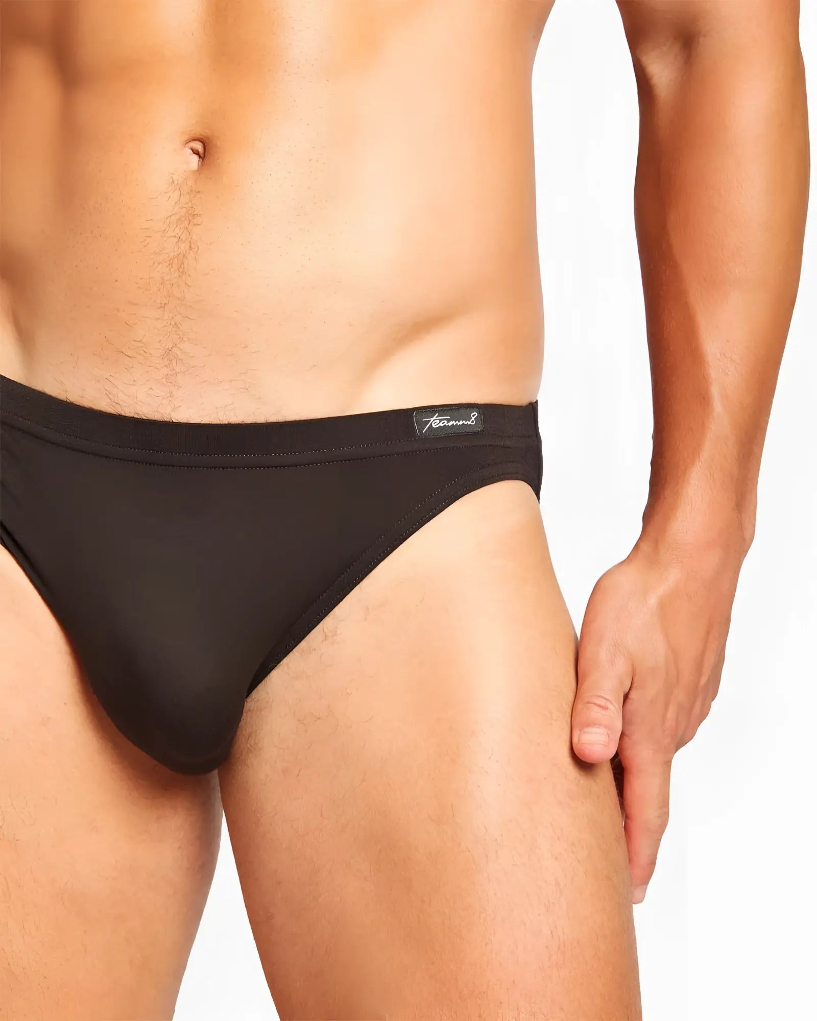 Black men’s body bamboo bikini brief with smooth form-fitting fabric and small branded tag on the waistband