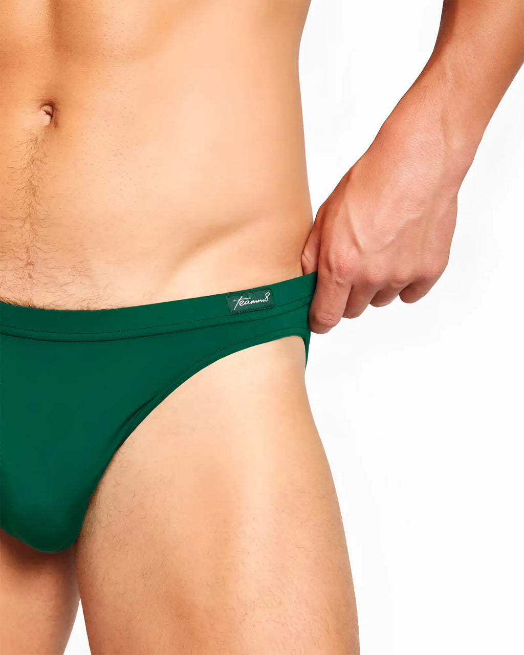 Dark green body bamboo bikini brief seamless fabric with subtle brand tag on waistband front view