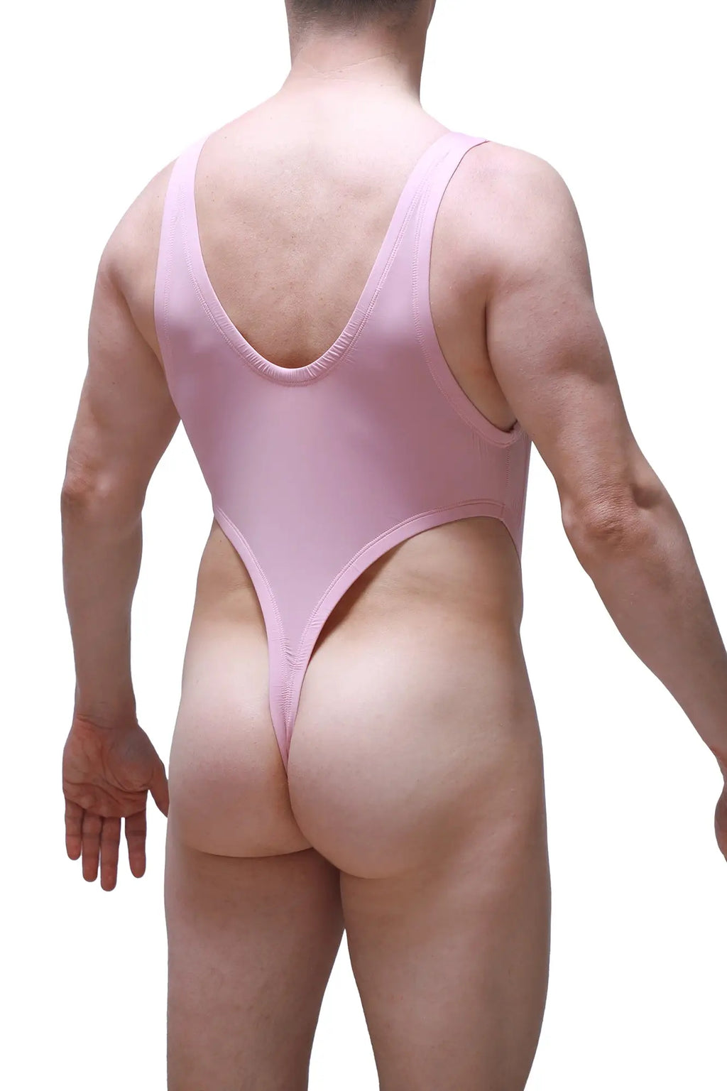 A sleek pink one-piece swimsuit bodythong gonzac skine tea rose shown from the back with deep v-back and high-cut legs