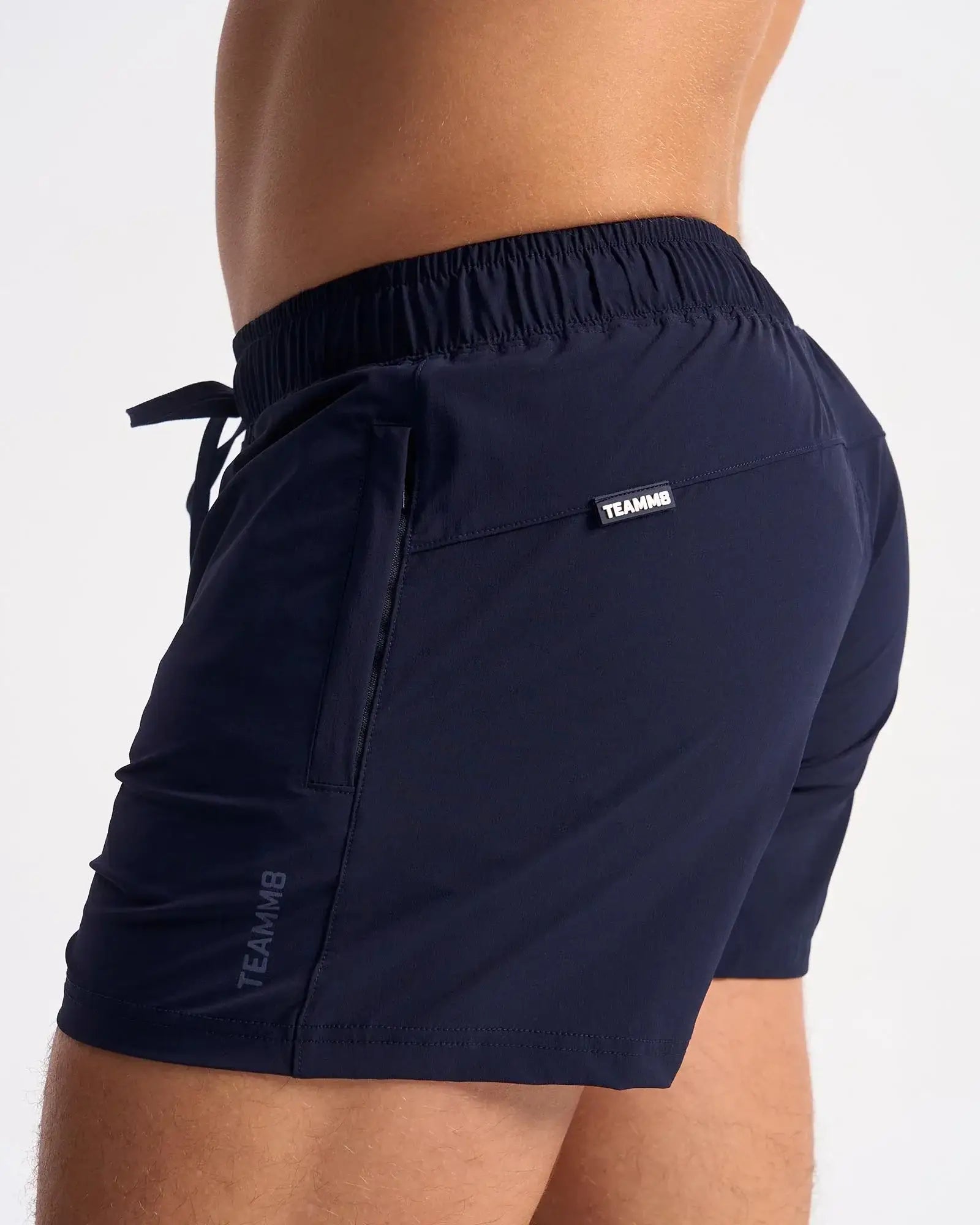 Navy blue bolt 3 inch athletic shorts with elastic waistband and side pockets for comfortable sportswear
